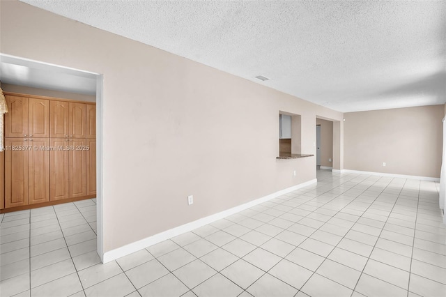 9200 SW 54th St, Cooper City, FL 33328 - empty room featuring light tile patterned floors and a textured ceiling