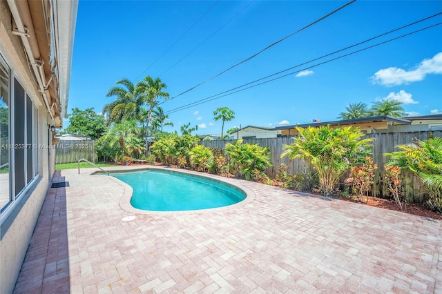 9200 SW 54th St, Cooper City, FL 33328 - view of swimming pool featuring a patio and a fenced backyard