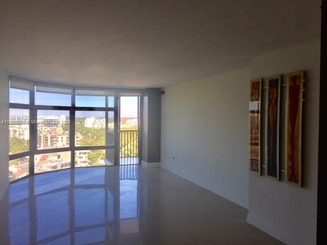 3375 N Country Club Dr Unit 1508, Aventura, FL 33180 - spare room with floor to ceiling windows, plenty of natural light, and a city view