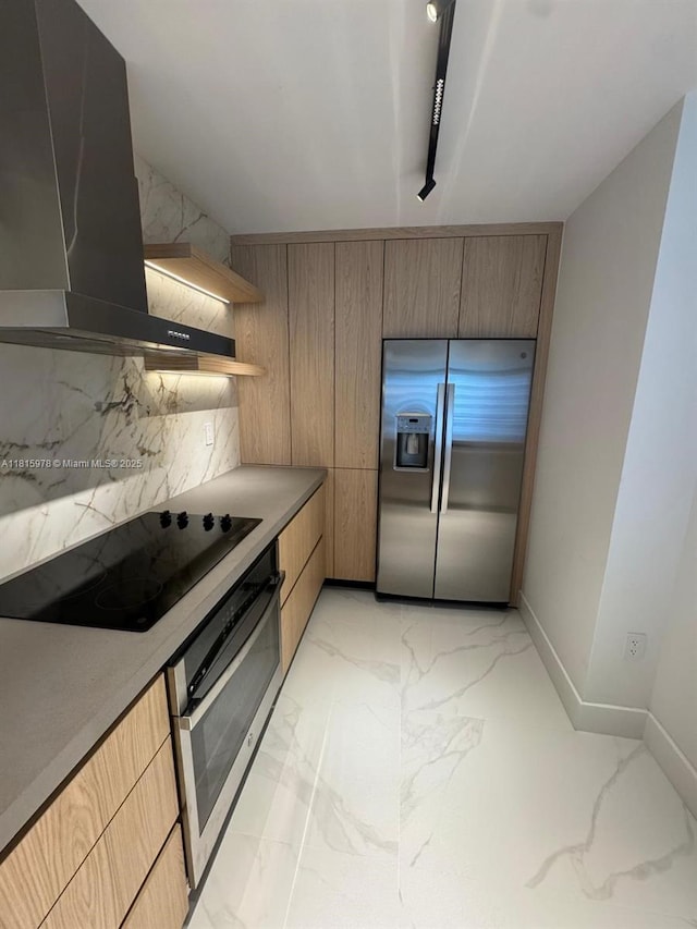 800 N Miami Ave Unit E-901, Miami, FL 33136 - kitchen with stainless steel appliances, wall chimney range hood, light marble finish floors, modern cabinets, and tasteful backsplash