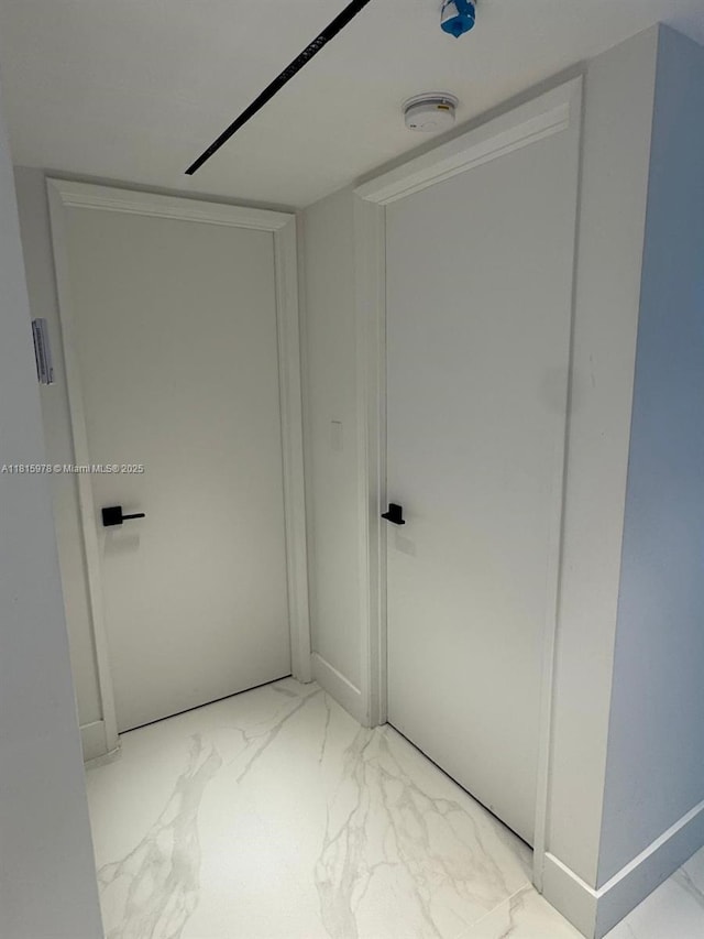 800 N Miami Ave Unit E-901, Miami, FL 33136 - hallway featuring marble look tile flooring