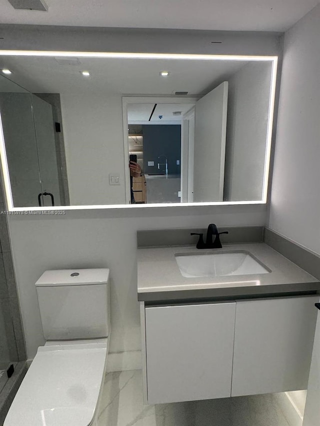 800 N Miami Ave Unit E-901, Miami, FL 33136 - bathroom featuring vanity, marble look tiles, and recessed lighting
