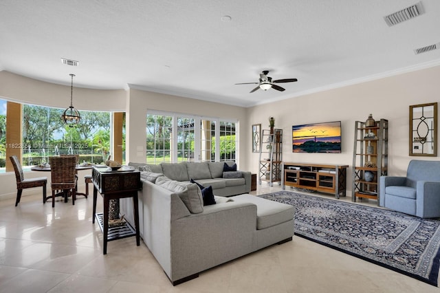 11844 Foxbriar Lake Trl, Boynton Beach, FL 33473 - living room with plenty of natural light, a ceiling fan, light tile patterned floors, and crown molding