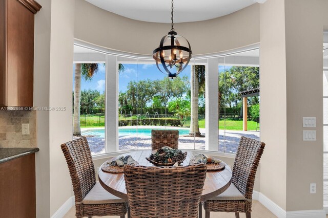 11844 Foxbriar Lake Trl, Boynton Beach, FL 33473 - dining space featuring plenty of natural light and a chandelier
