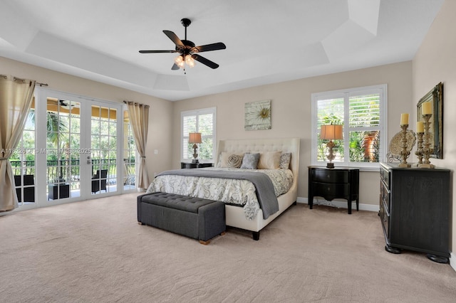 11844 Foxbriar Lake Trl, Boynton Beach, FL 33473 - bedroom featuring a tray ceiling, access to exterior, light carpet, french doors, and a ceiling fan