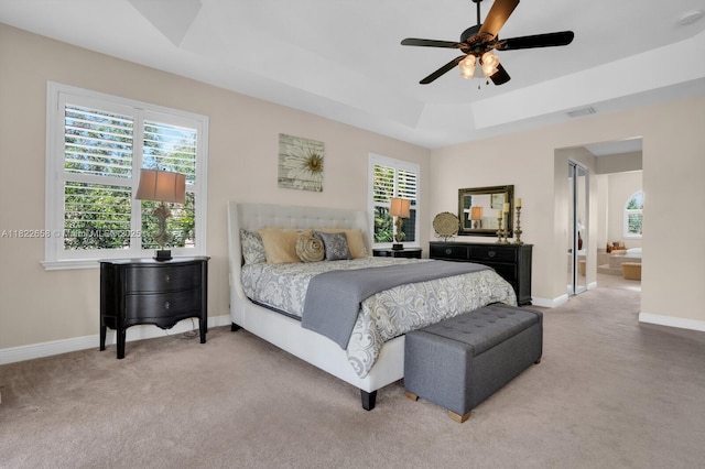 11844 Foxbriar Lake Trl, Boynton Beach, FL 33473 - carpeted bedroom featuring multiple windows, a tray ceiling, and ceiling fan