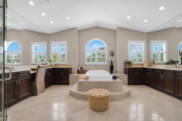 11844 Foxbriar Lake Trl, Boynton Beach, FL 33473 - full bath featuring vaulted ceiling, two vanities, a garden tub, recessed lighting, and tile patterned flooring