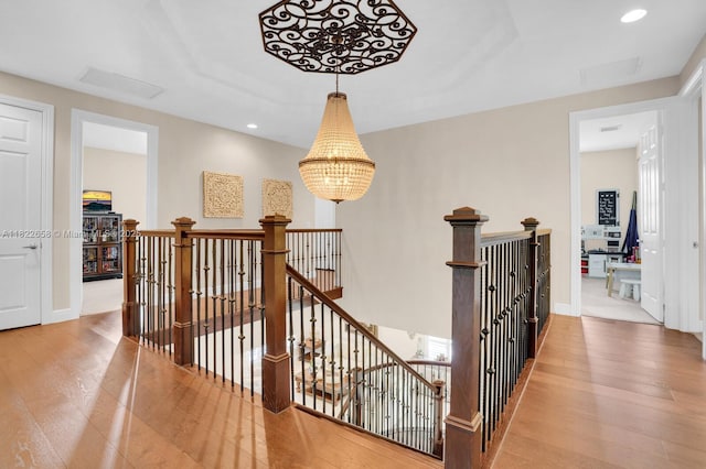 11844 Foxbriar Lake Trl, Boynton Beach, FL 33473 - hall featuring an upstairs landing, wood finished floors, a chandelier, and recessed lighting