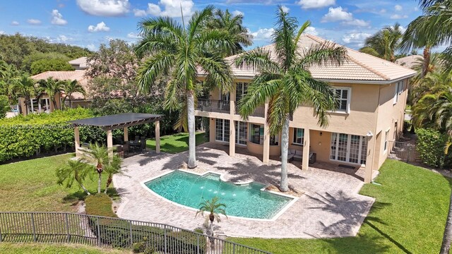 11844 Foxbriar Lake Trl, Boynton Beach, FL 33473 - back of house with a fenced backyard, stucco siding, a patio, and a tile roof