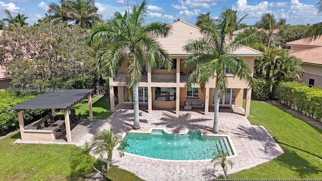 11844 Foxbriar Lake Trl, Boynton Beach, FL 33473 - back of house featuring an outdoor living space, a yard, a balcony, and a patio area