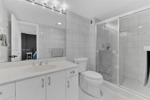2000 S Ocean Blvd Unit 11M, Lauderdale By The Sea, FL 33062 - bathroom featuring tile walls, vanity, and a stall shower