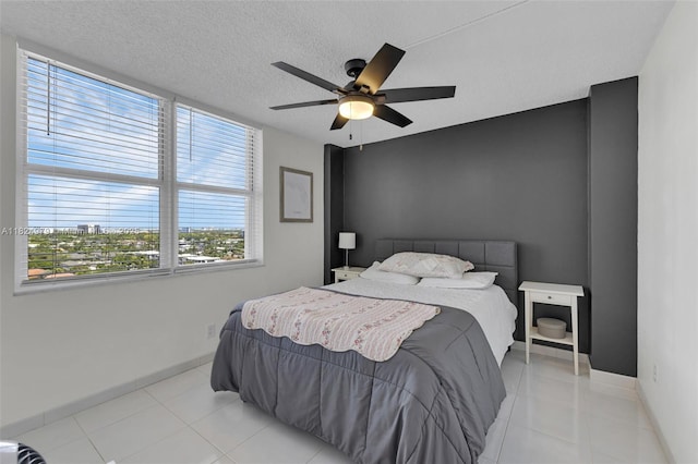 2000 S Ocean Blvd Unit 11M, Lauderdale By The Sea, FL 33062 - bedroom featuring light tile patterned floors, ceiling fan, and a textured ceiling