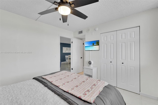 2000 S Ocean Blvd Unit 11M, Lauderdale By The Sea, FL 33062 - bedroom featuring a closet, a textured ceiling, light tile patterned flooring, and ceiling fan