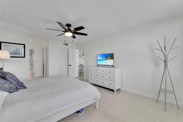 2000 S Ocean Blvd Unit 11M, Lauderdale By The Sea, FL 33062 - bedroom with a textured ceiling, ceiling fan, and light tile patterned flooring