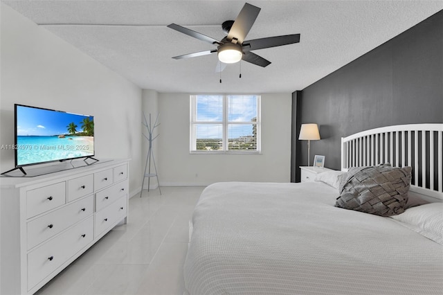 2000 S Ocean Blvd Unit 11M, Lauderdale By The Sea, FL 33062 - bedroom featuring light tile patterned floors, a ceiling fan, and a textured ceiling