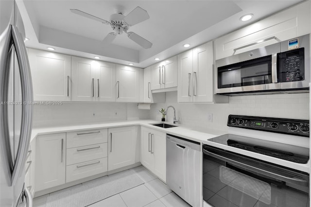 2000 S Ocean Blvd Unit 11M, Lauderdale By The Sea, FL 33062 - kitchen with stainless steel appliances, light tile patterned floors, recessed lighting, ceiling fan, and light countertops