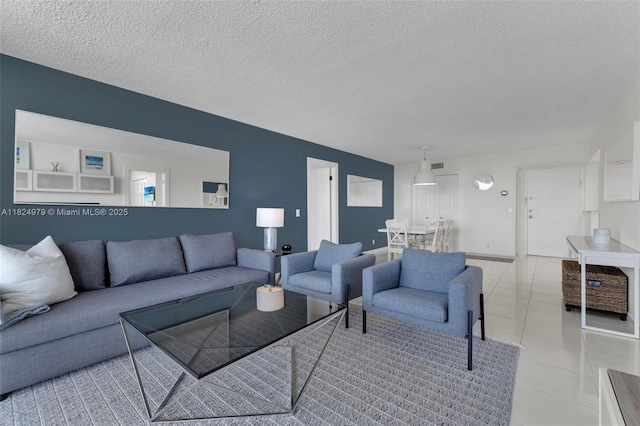 2000 S Ocean Blvd Unit 11M, Lauderdale By The Sea, FL 33062 - living area with a textured ceiling and tile patterned flooring