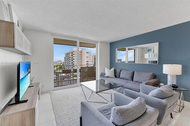 2000 S Ocean Blvd Unit 11M, Lauderdale By The Sea, FL 33062 - living room with healthy amount of natural light, a textured ceiling, and light tile patterned floors