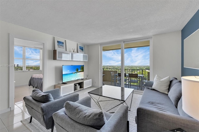 2000 S Ocean Blvd Unit 11M, Lauderdale By The Sea, FL 33062 - living room with a textured ceiling and light tile patterned floors