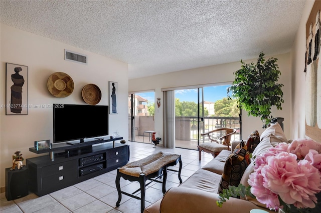 5800 SW 127th Ave Unit 2307, Miami, FL 33183 - living area featuring light tile patterned floors and a textured ceiling