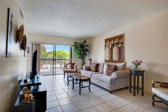 5800 SW 127th Ave Unit 2307, Miami, FL 33183 - living area featuring a textured ceiling and light tile patterned floors
