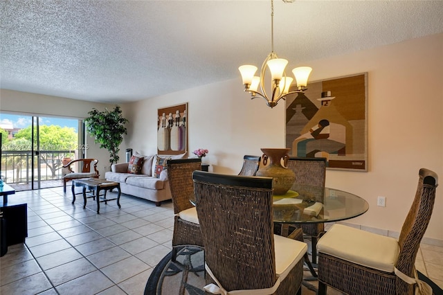 5800 SW 127th Ave Unit 2307, Miami, FL 33183 - dining room with a textured ceiling, a chandelier, and light tile patterned flooring