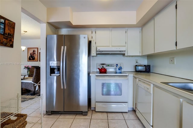 5800 SW 127th Ave Unit 2307, Miami, FL 33183 - kitchen featuring white appliances, under cabinet range hood, light tile patterned floors, and light countertops