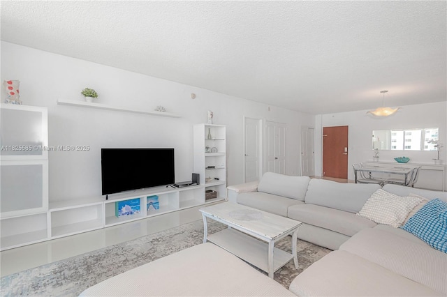 3901 S Ocean Dr Unit 12E, Hollywood, FL 33019 - living area with a textured ceiling