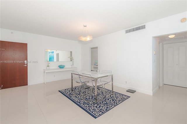 3901 S Ocean Dr Unit 12E, Hollywood, FL 33019 - dining area featuring tile patterned floors and baseboards