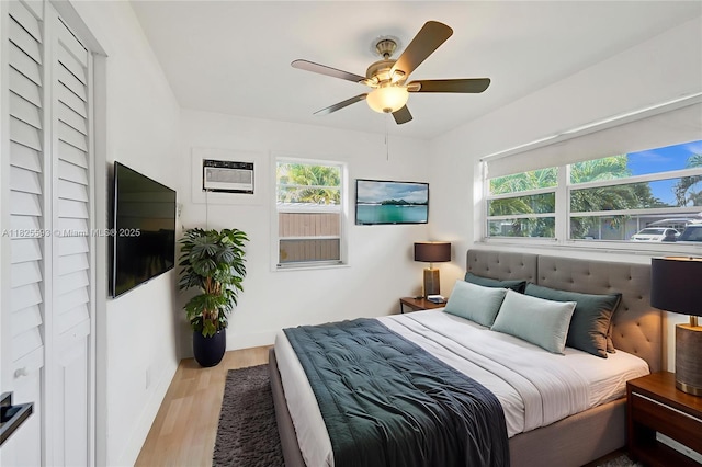 5615 Branch St, Hollywood, FL 33021 - bedroom with wood finished floors, ceiling fan, and an AC wall unit