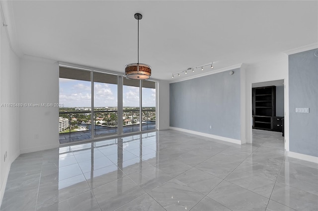 1 N Ocean Blvd Unit 1211, Pompano Beach, FL 33062 - empty room with rail lighting, a wall of windows, and ornamental molding