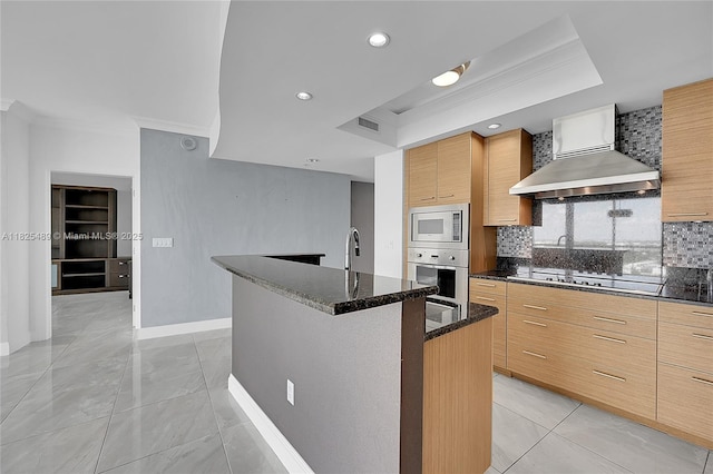 1 N Ocean Blvd Unit 1211, Pompano Beach, FL 33062 - kitchen with wall chimney exhaust hood, oven, ornamental molding, built in microwave, and black electric cooktop