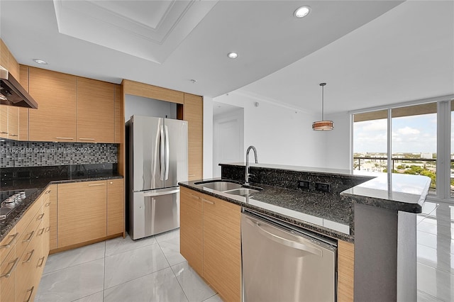 1 N Ocean Blvd Unit 1211, Pompano Beach, FL 33062 - kitchen featuring stainless steel appliances, dark stone counters, tasteful backsplash, pendant lighting, and modern cabinets