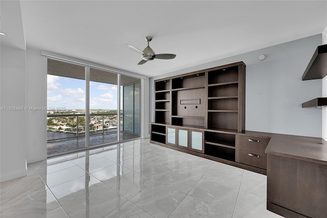 1 N Ocean Blvd Unit 1211, Pompano Beach, FL 33062 - empty room with light marble finish floors, a ceiling fan, and expansive windows