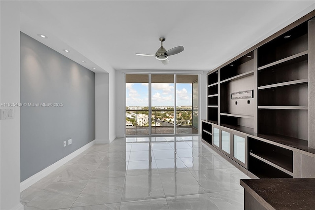 1 N Ocean Blvd Unit 1211, Pompano Beach, FL 33062 - spare room featuring light marble finish flooring, ceiling fan, floor to ceiling windows, recessed lighting, and built in features