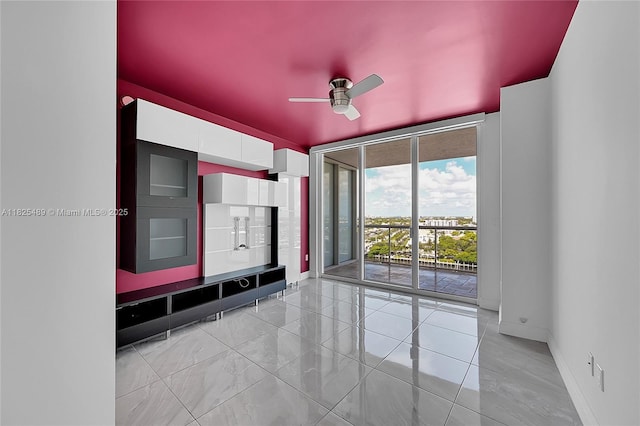 1 N Ocean Blvd Unit 1211, Pompano Beach, FL 33062 - empty room with a ceiling fan and expansive windows