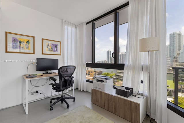 520 Brickell Key Dr Unit A1421, Miami, FL 33131 - office with a view of skyline and concrete flooring