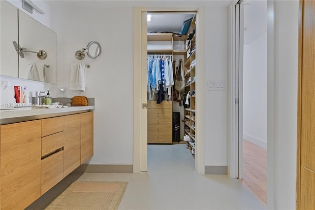 520 Brickell Key Dr Unit A1421, Miami, FL 33131 - full bathroom featuring vanity and a spacious closet