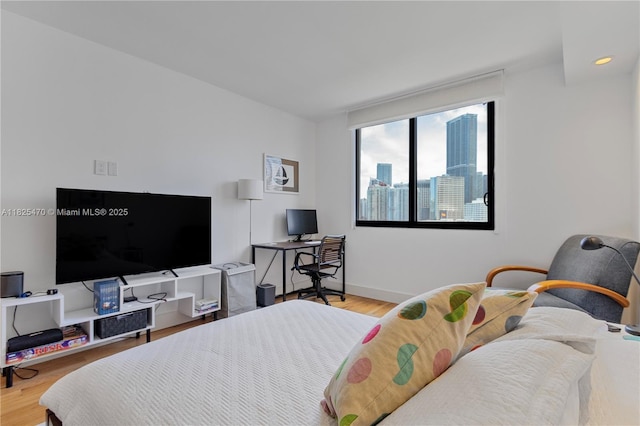 520 Brickell Key Dr Unit A1421, Miami, FL 33131 - bedroom with wood finished floors and an office area