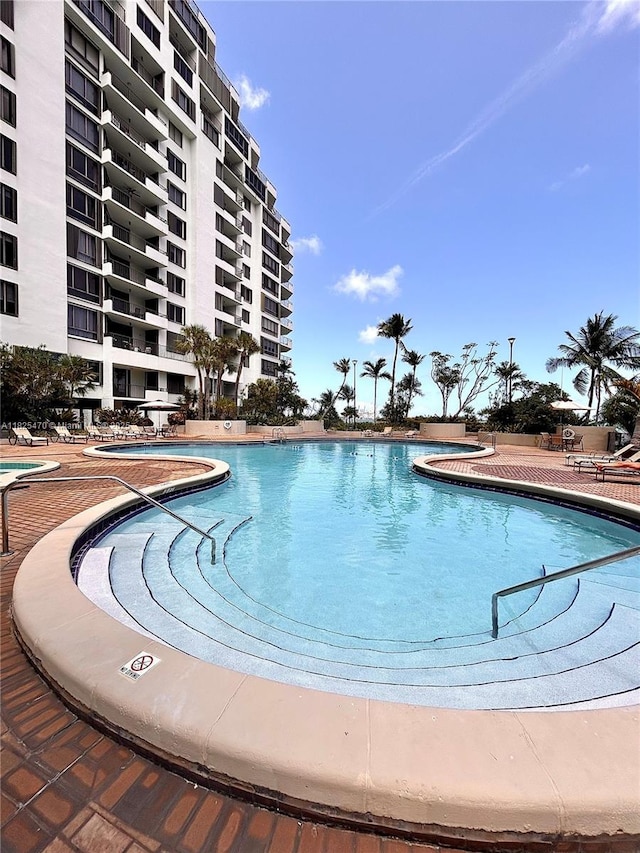 520 Brickell Key Dr Unit A1421, Miami, FL 33131 - community pool featuring a patio area