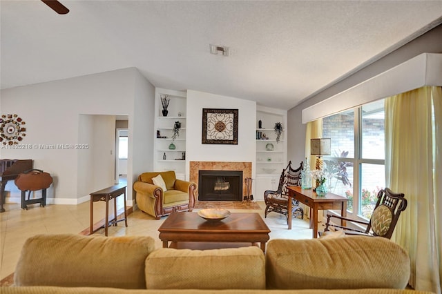 10967 NW 12th Dr, Coral Springs, FL 33071 - living area with vaulted ceiling, a fireplace with flush hearth, built in features, and a ceiling fan