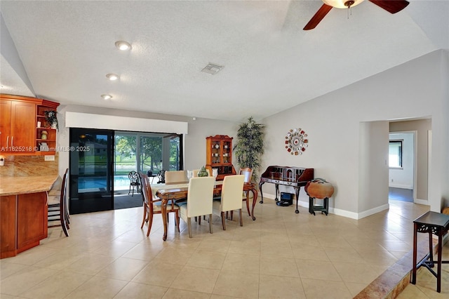 10967 NW 12th Dr, Coral Springs, FL 33071 - dining room with a ceiling fan, lofted ceiling, a textured ceiling, and light tile patterned floors