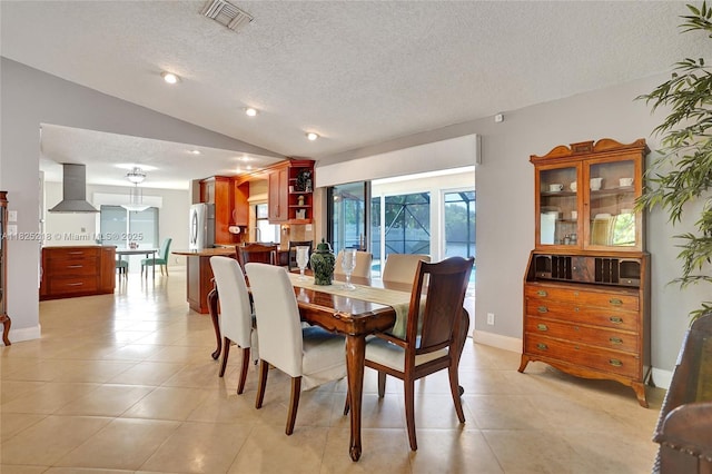 10967 NW 12th Dr, Coral Springs, FL 33071 - dining area featuring a textured ceiling, vaulted ceiling, light tile patterned floors, and recessed lighting