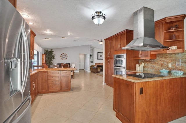 10967 NW 12th Dr, Coral Springs, FL 33071 - kitchen with stainless steel appliances, wall chimney exhaust hood, a peninsula, decorative backsplash, and brown cabinets