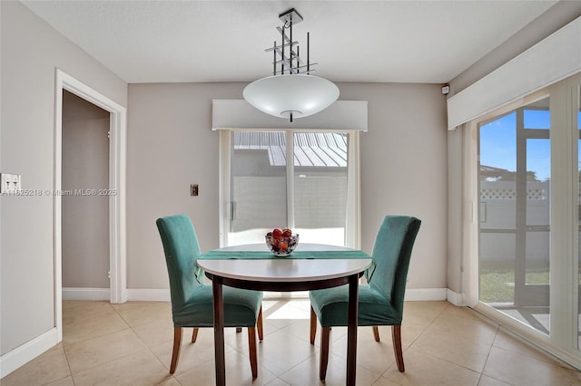 10967 NW 12th Dr, Coral Springs, FL 33071 - dining area with healthy amount of natural light and light tile patterned floors