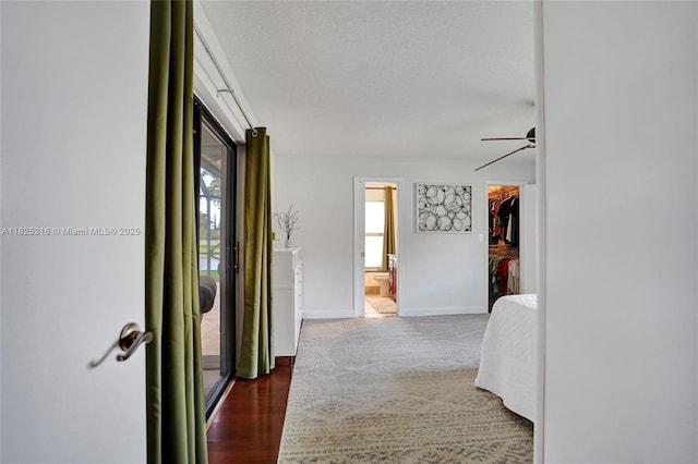 10967 NW 12th Dr, Coral Springs, FL 33071 - corridor with baseboards and a textured ceiling