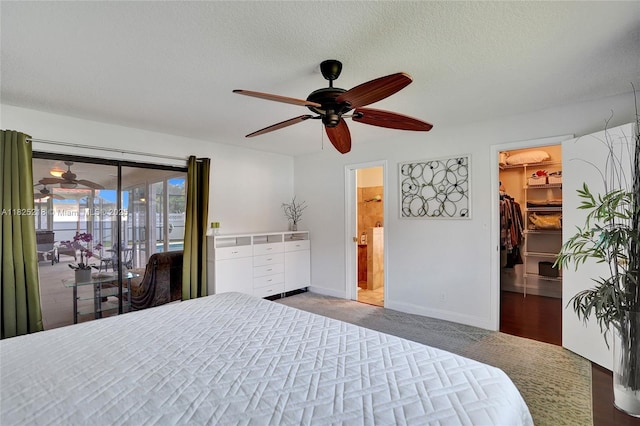 10967 NW 12th Dr, Coral Springs, FL 33071 - carpeted bedroom featuring access to outside, a walk in closet, a ceiling fan, connected bathroom, and a textured ceiling