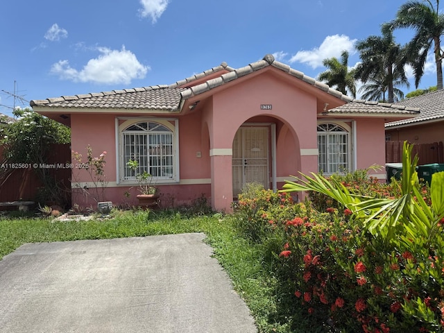9703 NW 127th St, Hialeah Gardens, FL 33018 - view of front of house featuring a tile roof and stucco siding