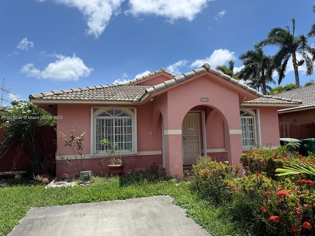 9703 NW 127th St, Hialeah Gardens, FL 33018 - view of front of property with stucco siding and a tiled roof