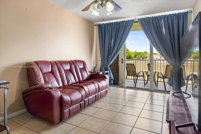 616 NW 26th Ave Unit 210, Miami, FL 33125 - living area featuring a ceiling fan, light tile patterned floors, and a textured ceiling